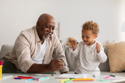 Sixty-two year old grandfather considers the pros and cons of reverse mortgage with his grandchild.