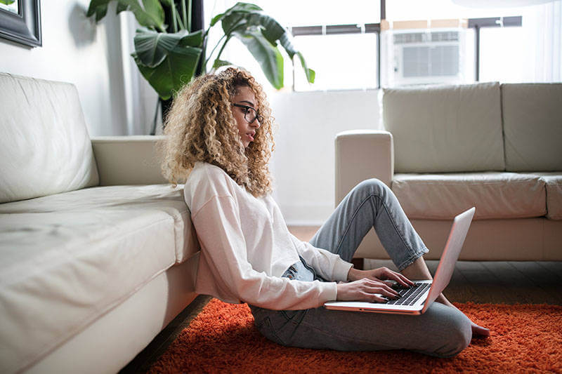 Woman sitting on computer