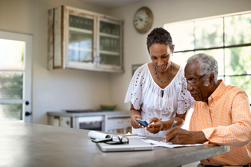 A man and woman filling out paperwork